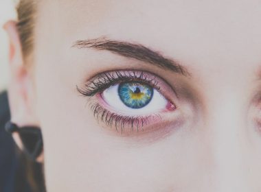 Woman wearing striking blue contact lenses, showcasing their transformative effect.
